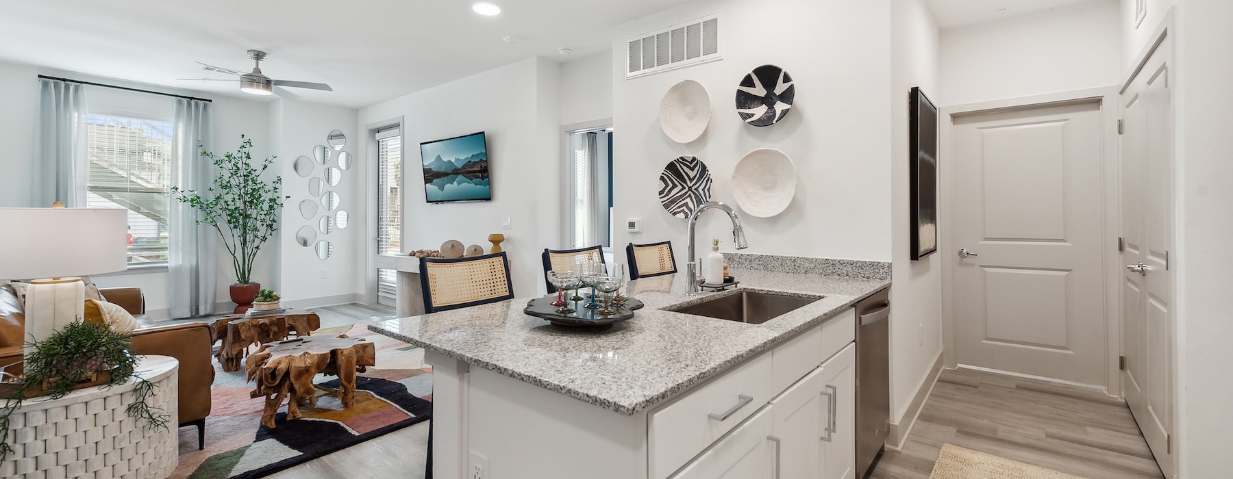 a kitchen with white cabinets