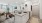 a kitchen with white cabinets